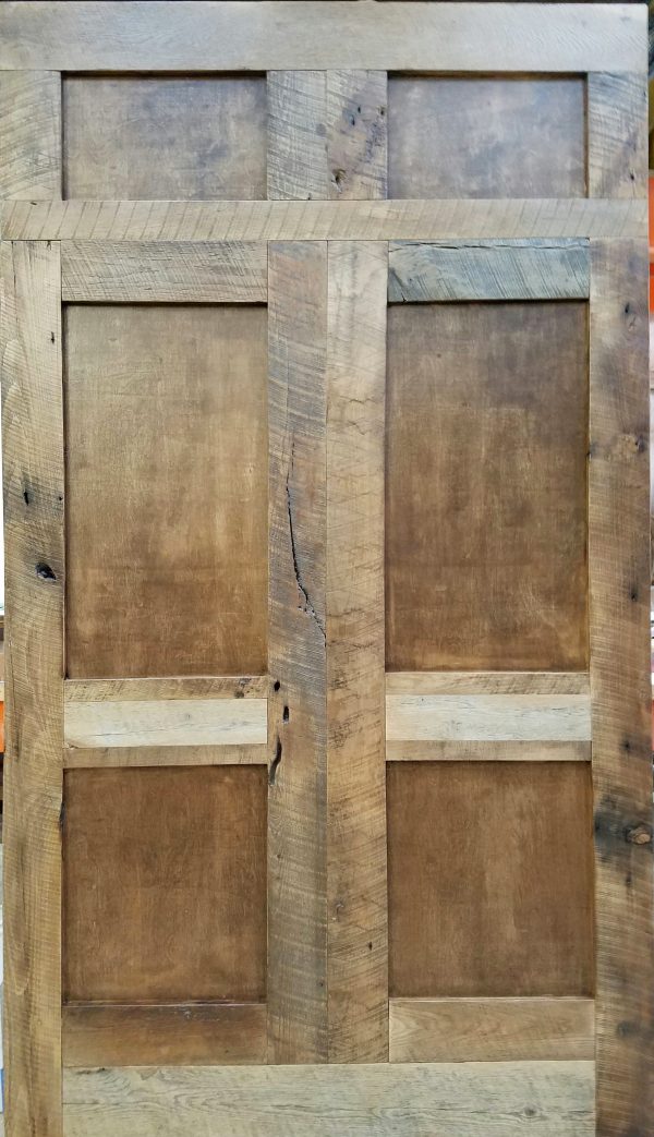 Custom designed Barn Doors with reclaimed wood and hand fabricated original panel inlay